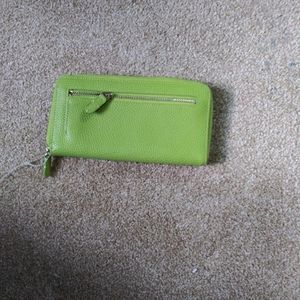 Tusk multi compartment leather wallet Measures 8 inch length  and 4.5 inches